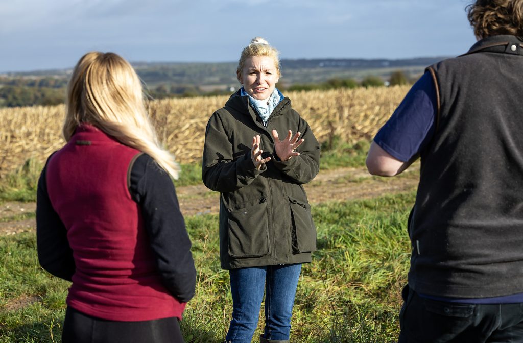 UCS lecturer leading a practical session in a field.