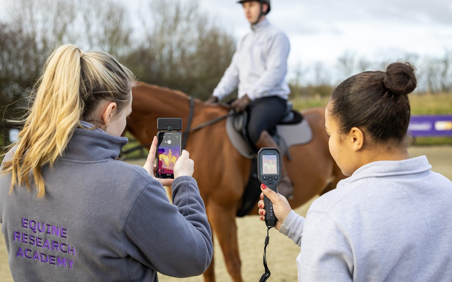 Learners using thermal imaging devices in an equine demonstration