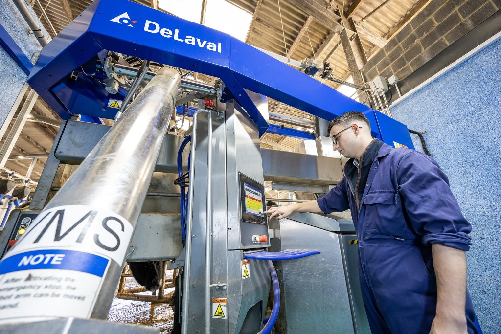 Student using DeLaval Voluntary Milking System