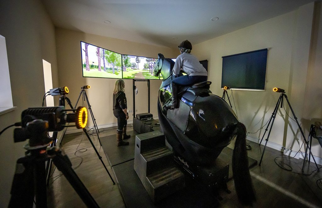 Student uses an equine performance simulator